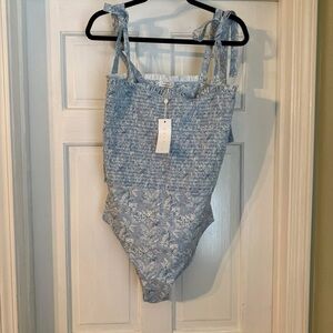 Minnow x Tuckernuck 
Light Blue Smocked One-Piece Swimsuit with Floral Print